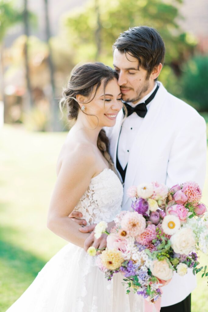 colorful california bridal session bride and groom smile outdoors