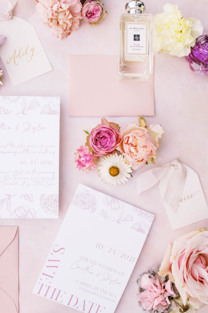 colorful california bridal session flat lay with invitation suite
