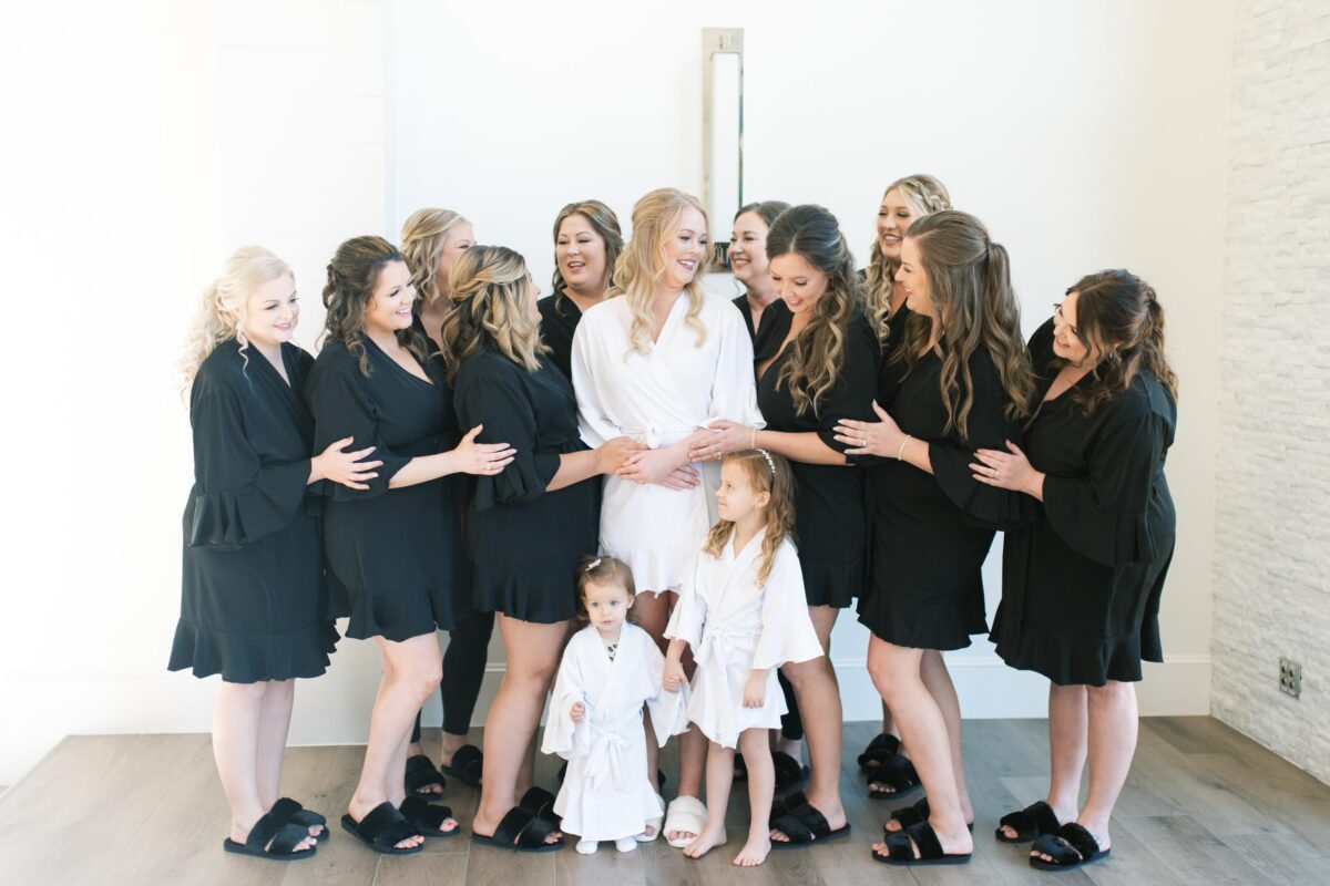bridal party in black and white robes