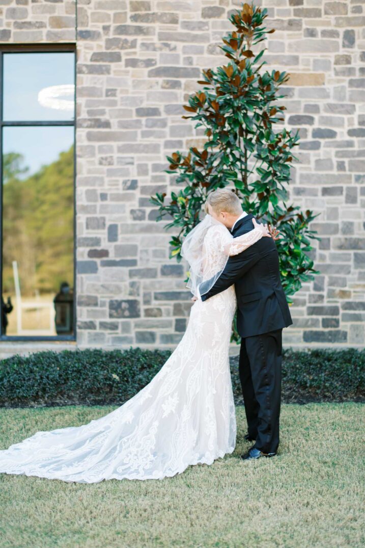 Houston winter wedding at The Luminaire with the bride and groom hugging