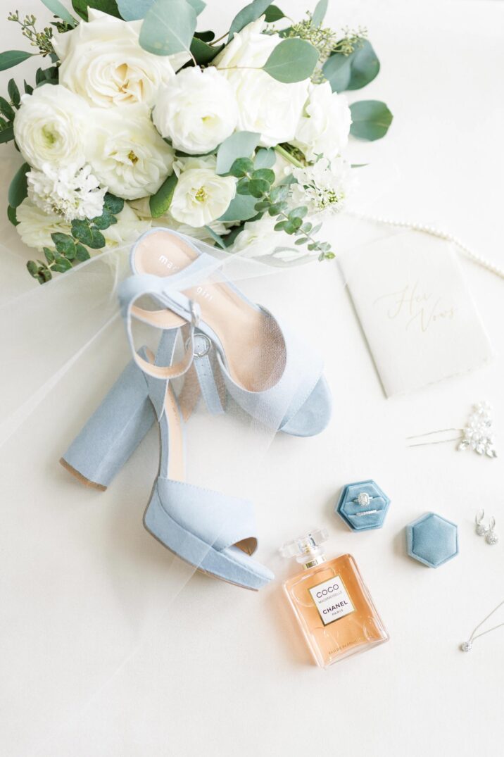 blue Houston modern wedding with bridal details including light blue heels, hair pins, rings, and Coco Chanel perfume