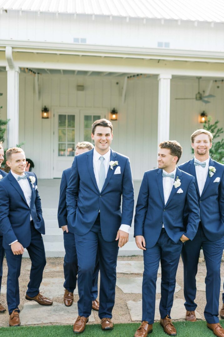 blue Houston modern wedding groomsmen wearing navy suits and light blue ties