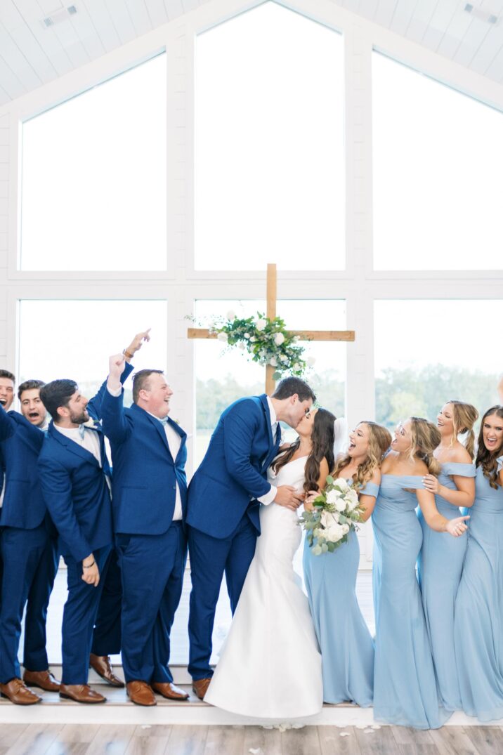 ceremony kiss at blue Houston modern wedding