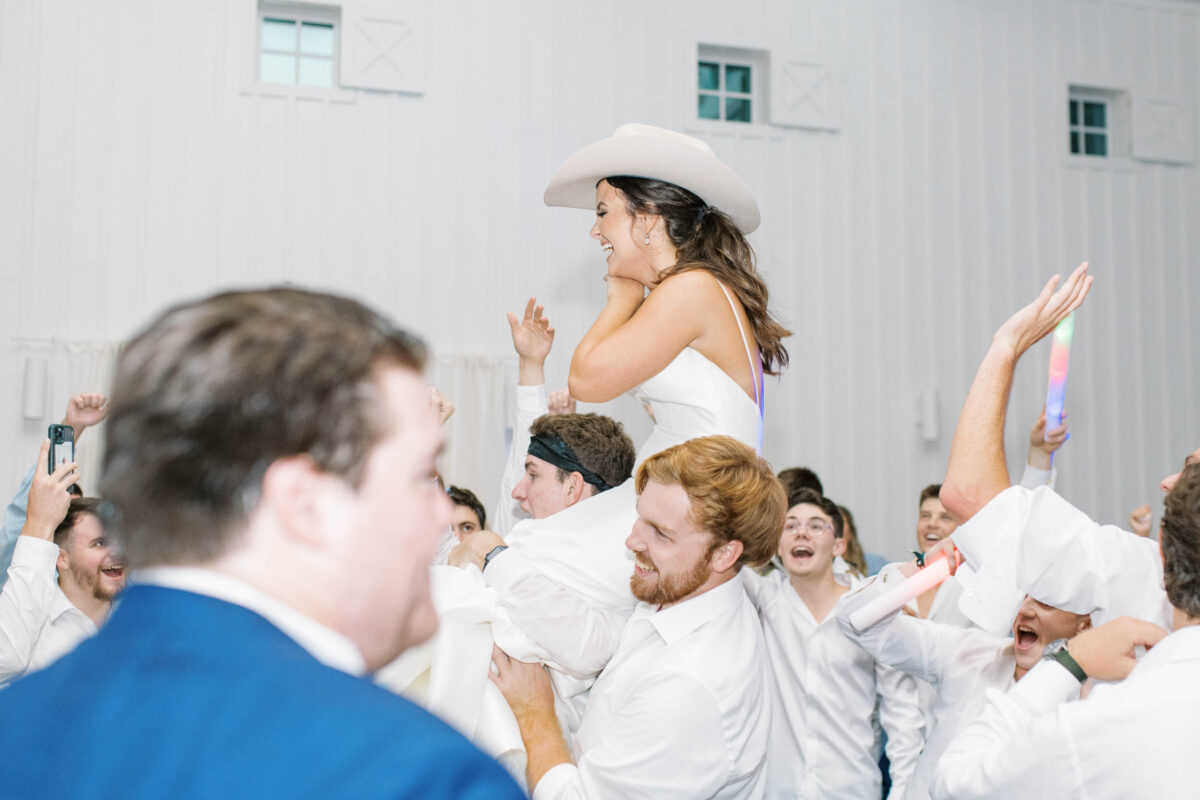 bride lifted up at reception 