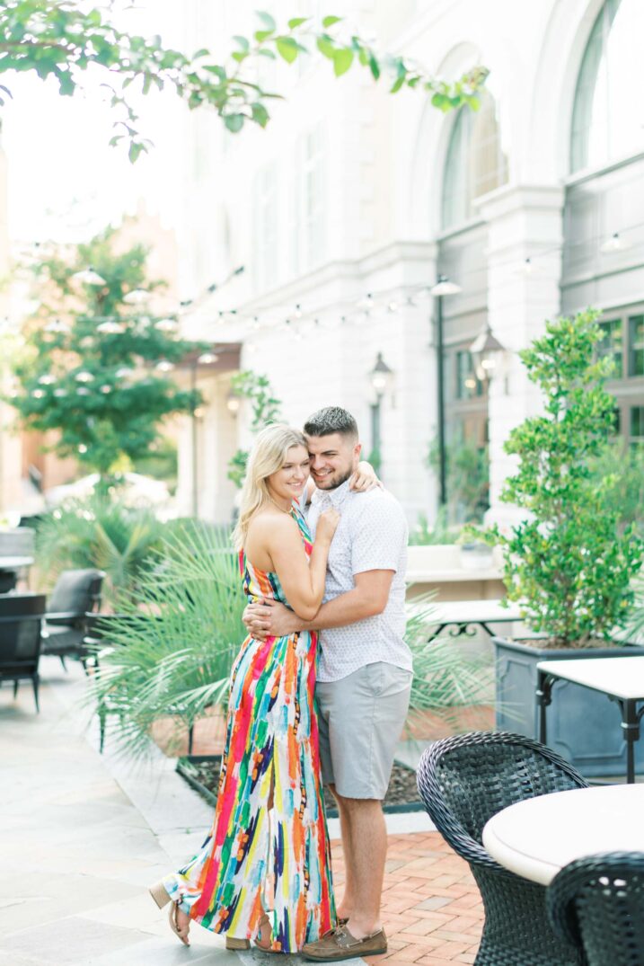 charleston engagement session with large amounts of greenery in outdoor patio