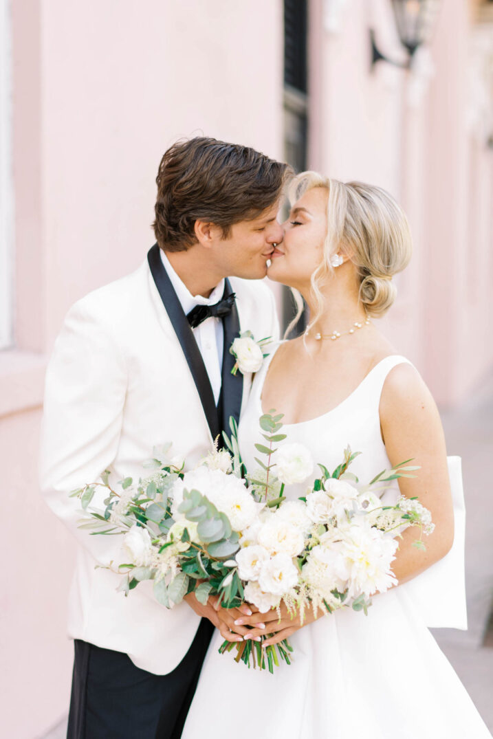 charleston bride groom classic kiss eucalyptus white flower arrangement