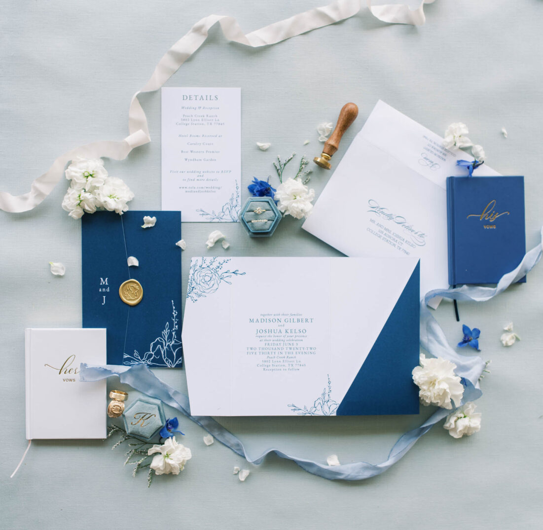 blue and white summer invitation flatlay
