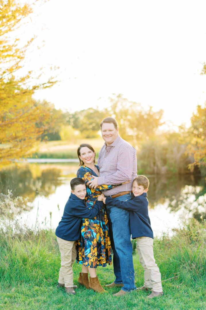 fall leaves family portraits texas hugging