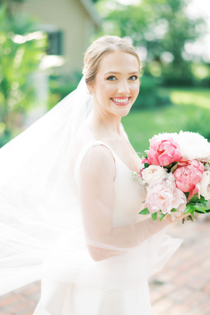 hill country bridal headshot with wind swept veil