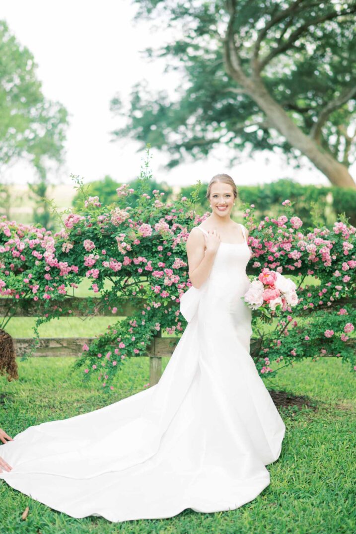 hill country bridal full wedding dress and pink flowers