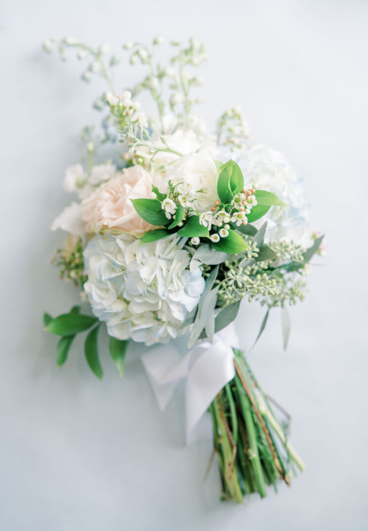 bride's bouquet with blue hydrangeas and pastel garden roses