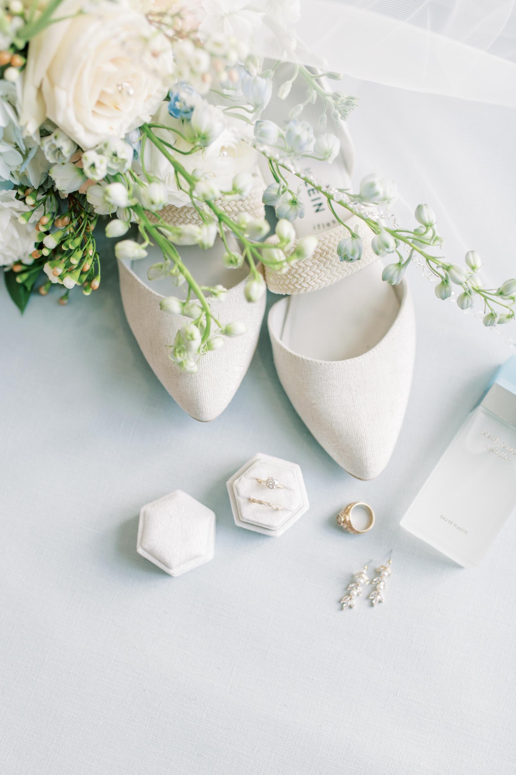 blue farmhouse wedding Houston detail shot with white heels and snapdragon
