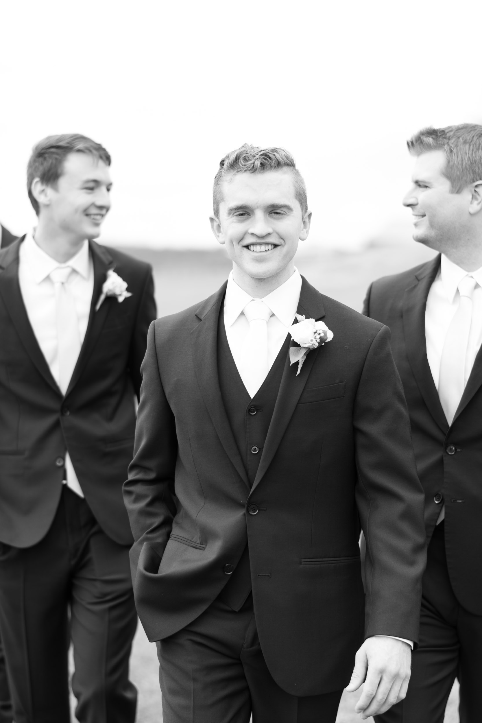 black and white groom and best man