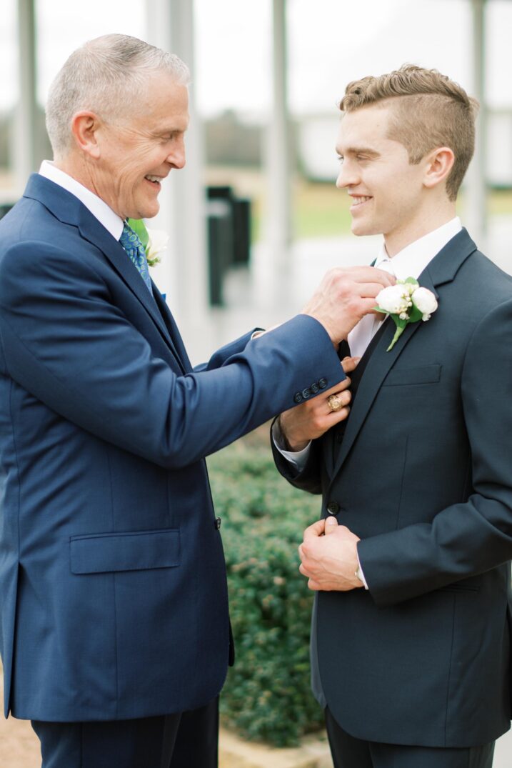 father of the bride fixing groom's tie