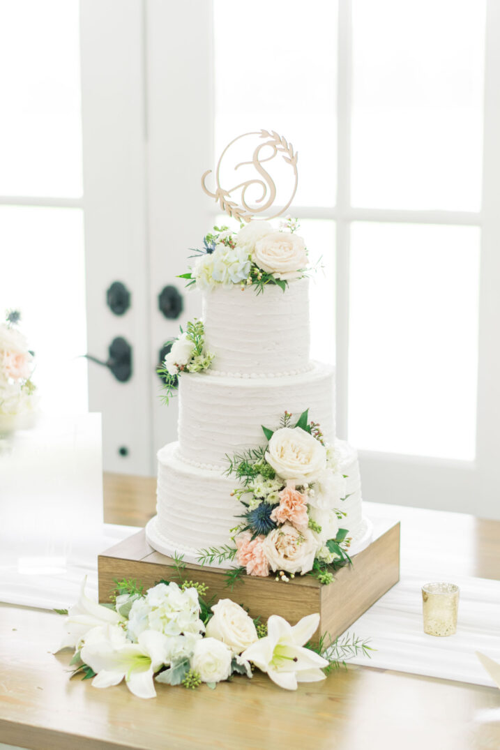 wedding cake from Grammy Cake with white and pink flowers in Houston, Texas 
