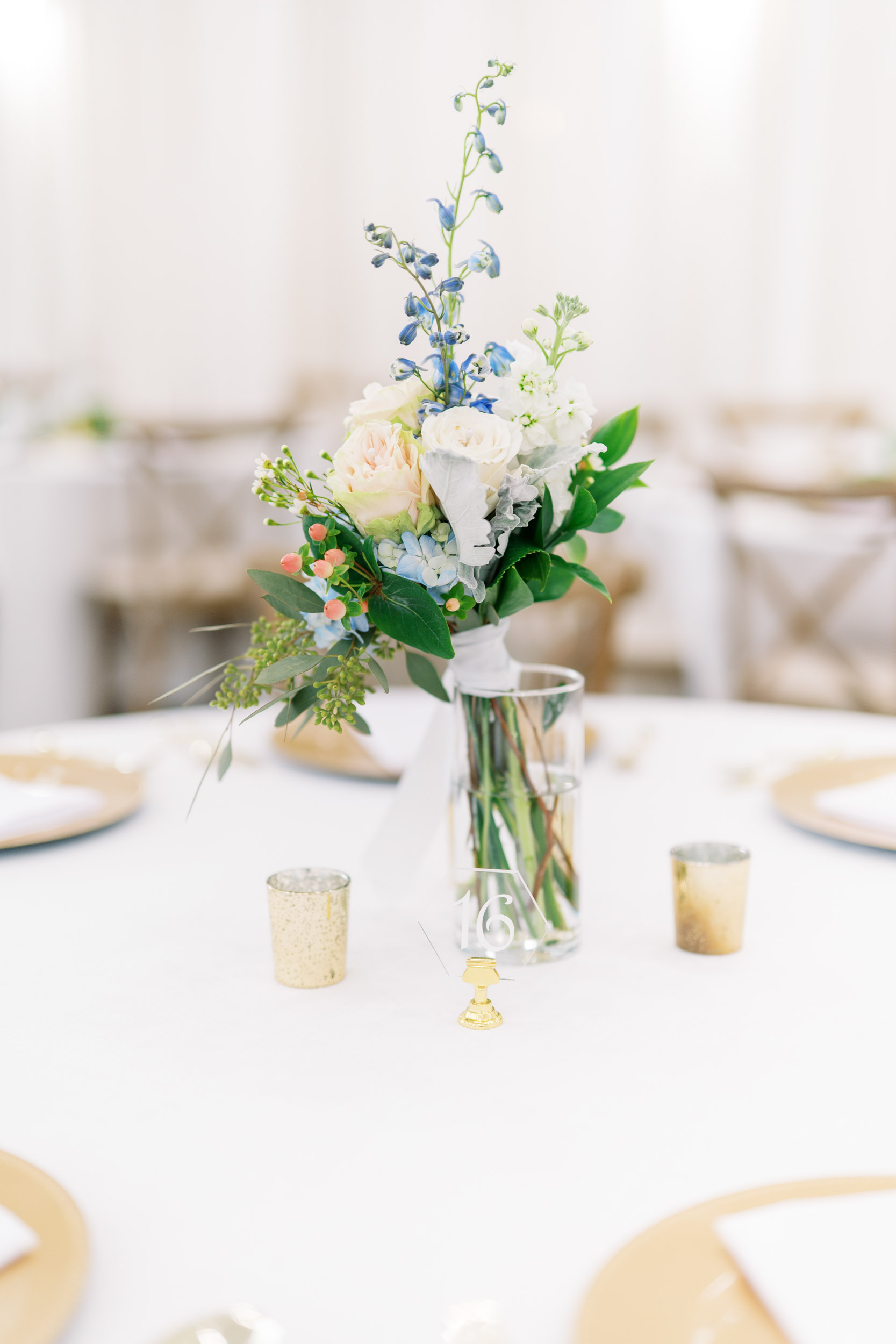 blue farmhouse wedding Houston reception floral arrangement at one of the guest tables