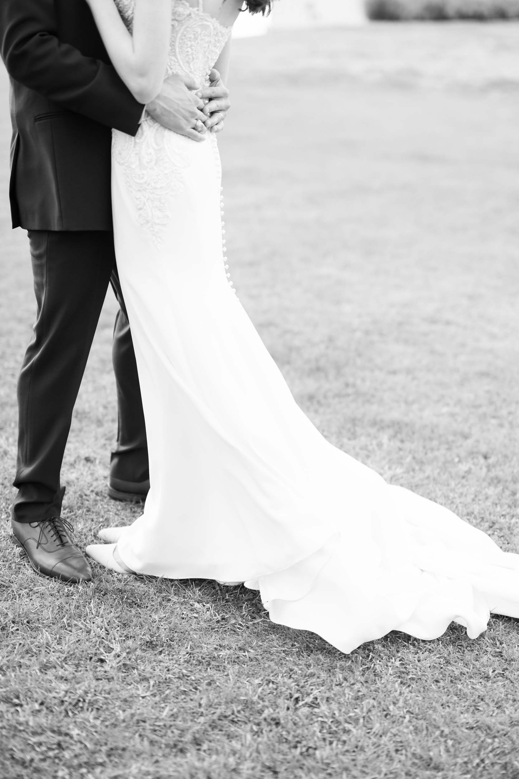 black and white wedding dress shot with lace detail and buttons 