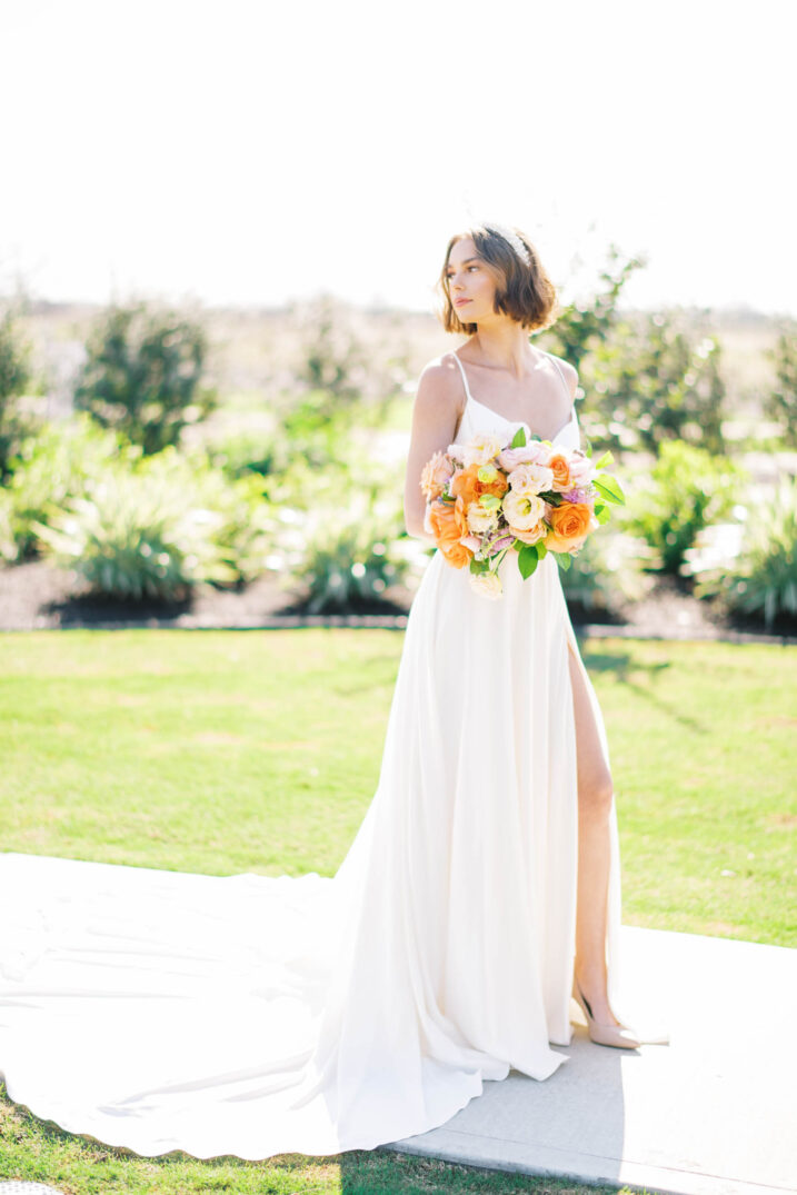 bridal editorial portraits with orange and pink floral bouquet