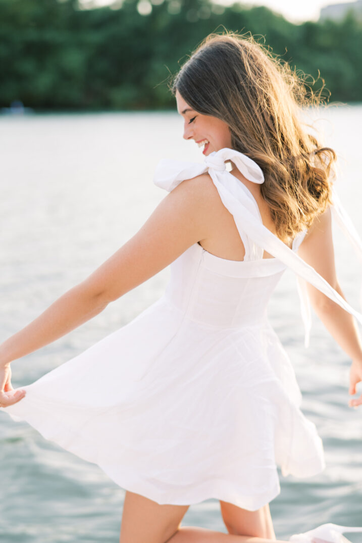 windy lake portraits white dress with bow tied straps