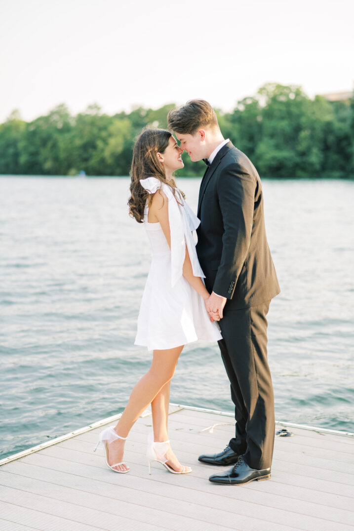 town lake engagement couple standing on dock