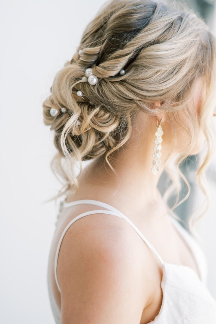 studio bridal portrait close up of softly curled wedding updo with pearls