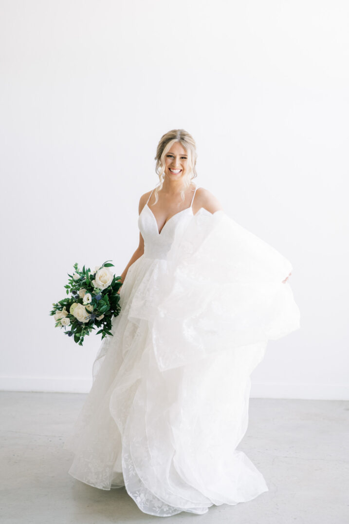 modern studio bridal session twirling wedding dress