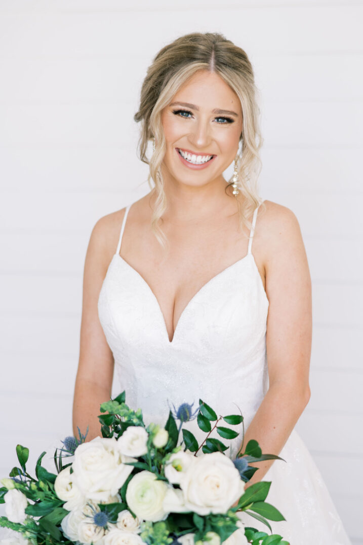 bridal session in austin studio closeup blue thistle and white rose bouquet