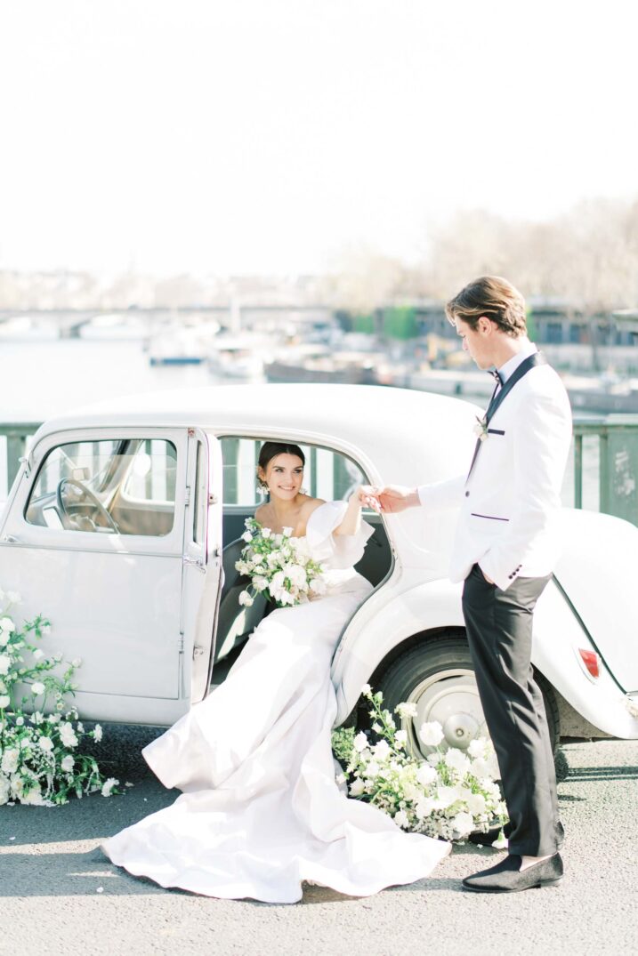 Parisian bride groom Eiffel getting in an old vintage car 