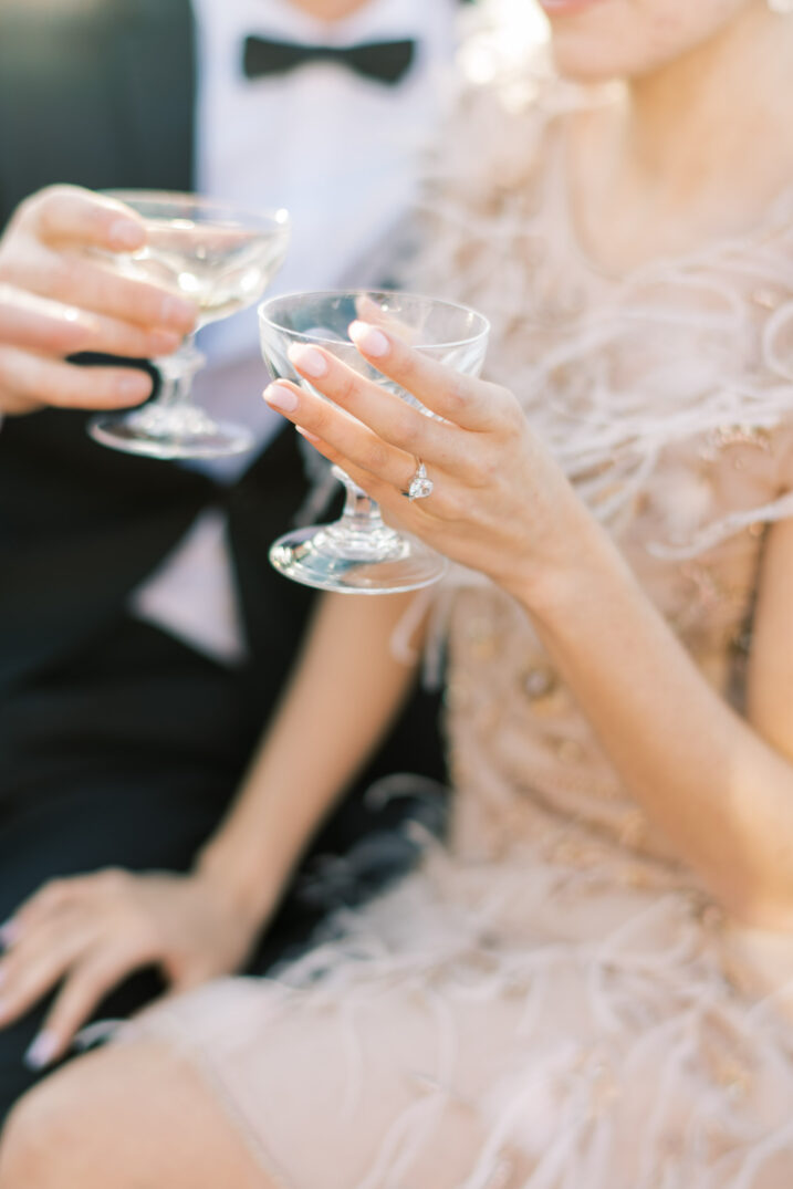 editorial portraits seine paris couple holding small wine glasses 