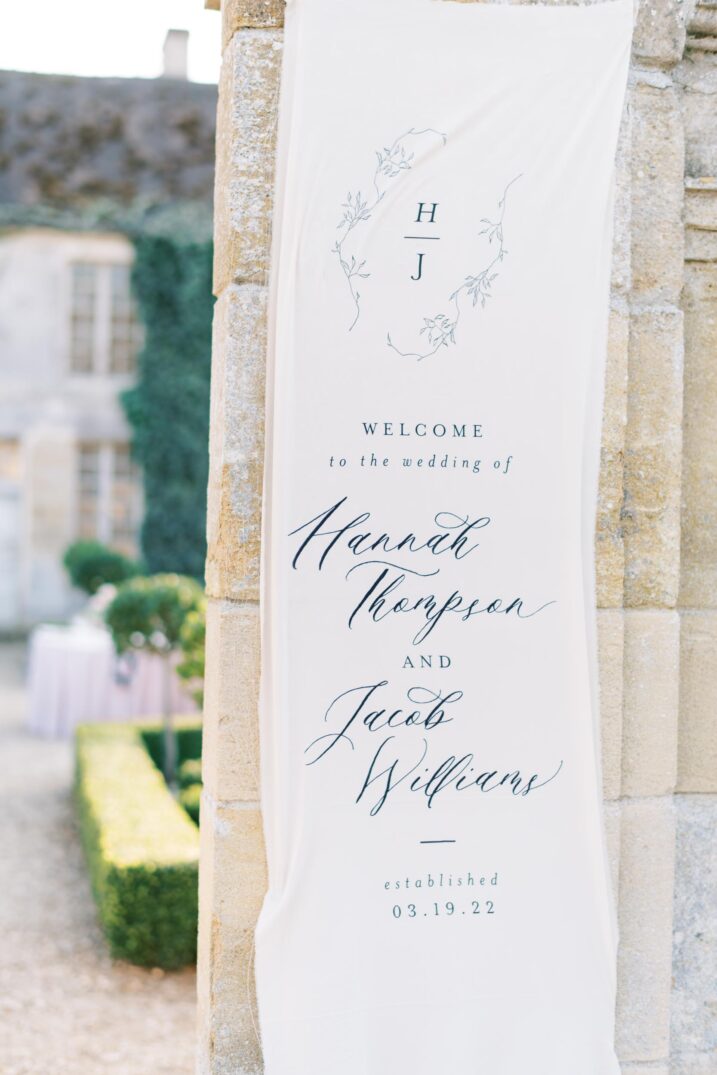 custom wedding banner sign outside Paris courtyard