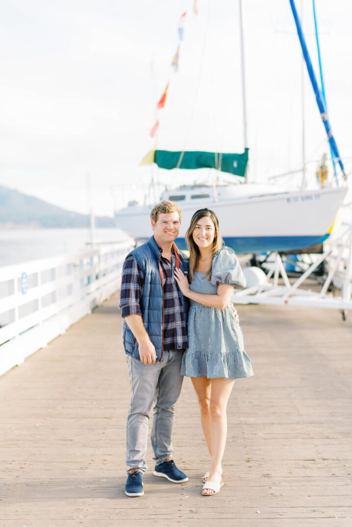 couple on boardwalk area for pebble beach engagement