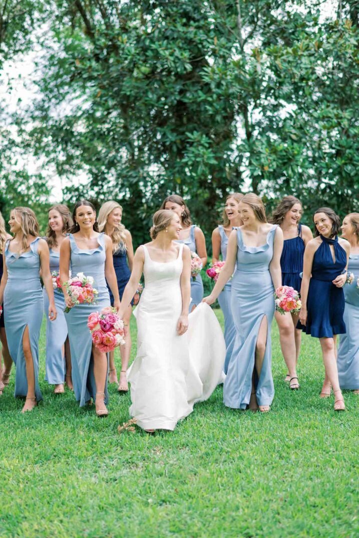 bridesmaids and house party walking with the bride outside