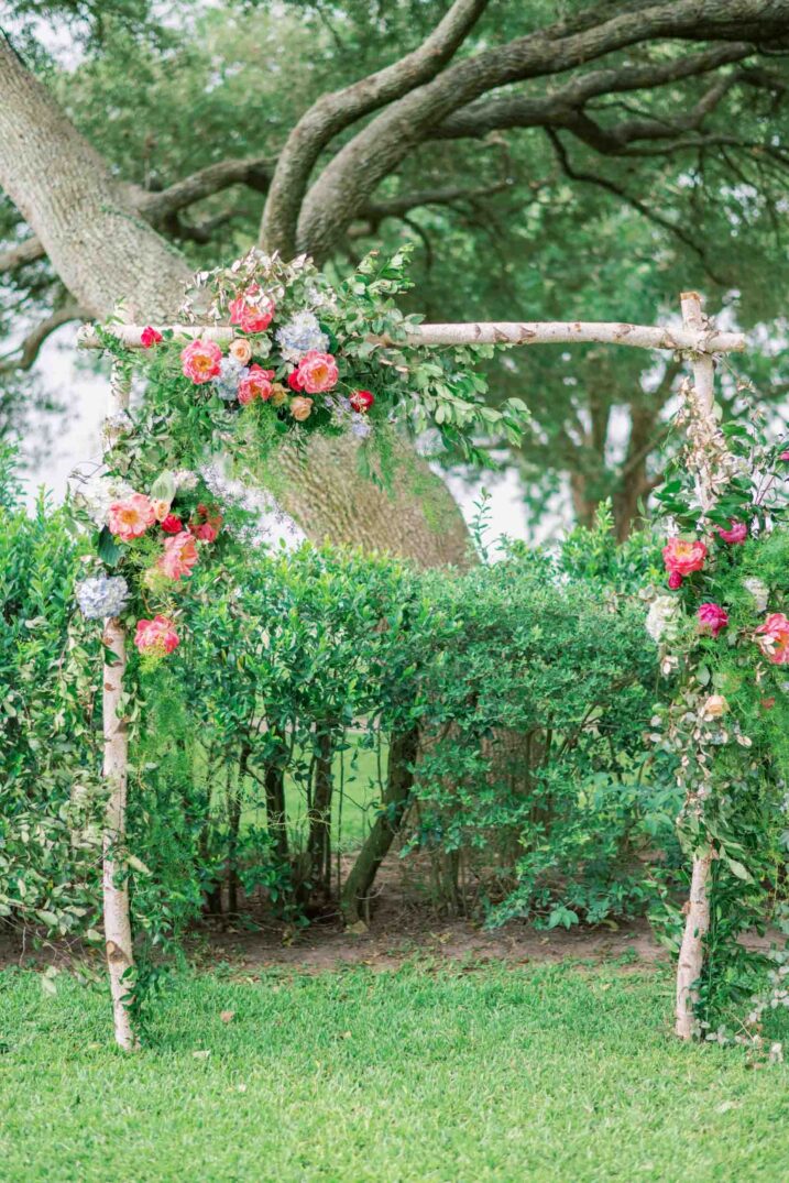 texas hill country luxury wedding outdoor altar vibrant florals