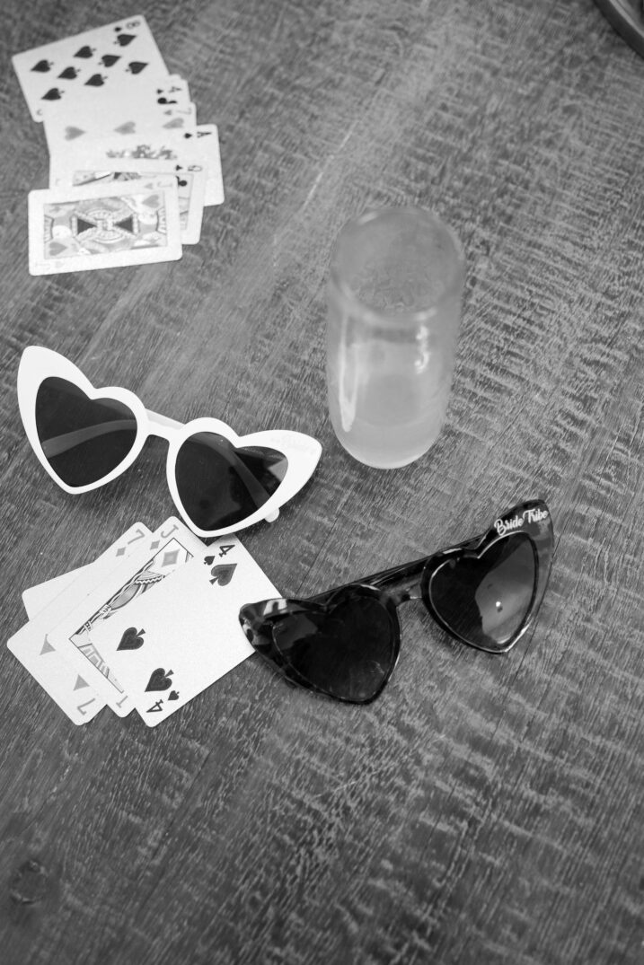 black and white heart eye sunglasses and card games before wedding