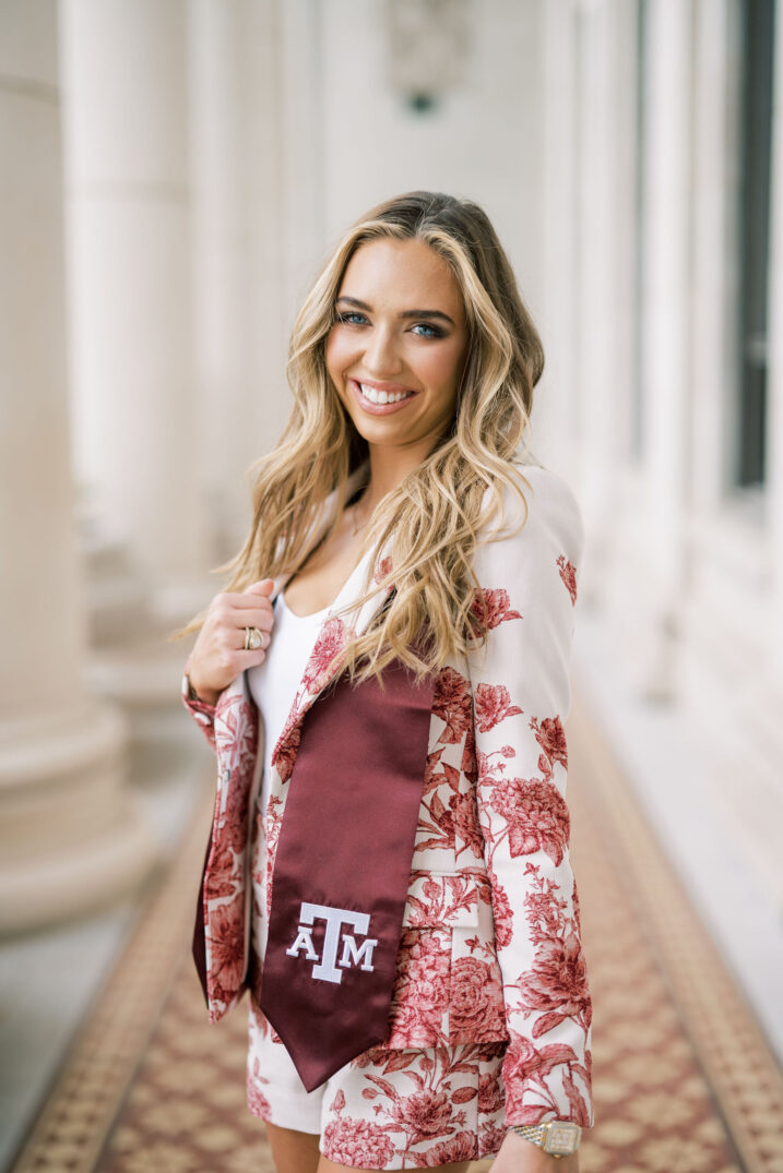 chic senior Texas A&M at the academic building with graduation stole