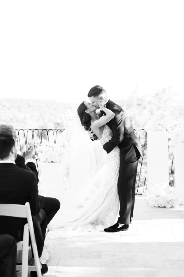 black and white Italian inspired wedding first kiss at the altar