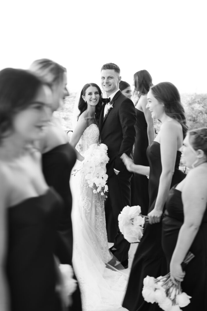 black and white bridal party walking by Italian inspired wedding