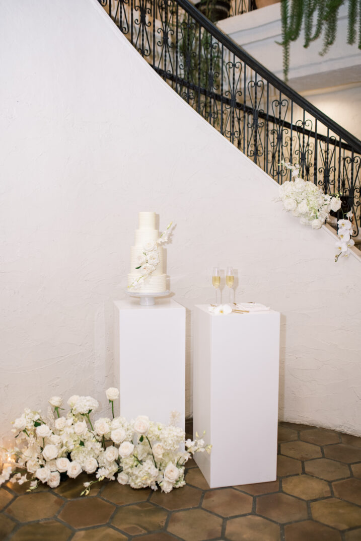 wedding cake spiral staircase white floral details Italian inspired wedding