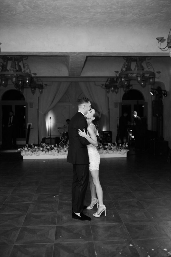 black and white photo final dance kiss wedding reception Italian inspired wedding 
