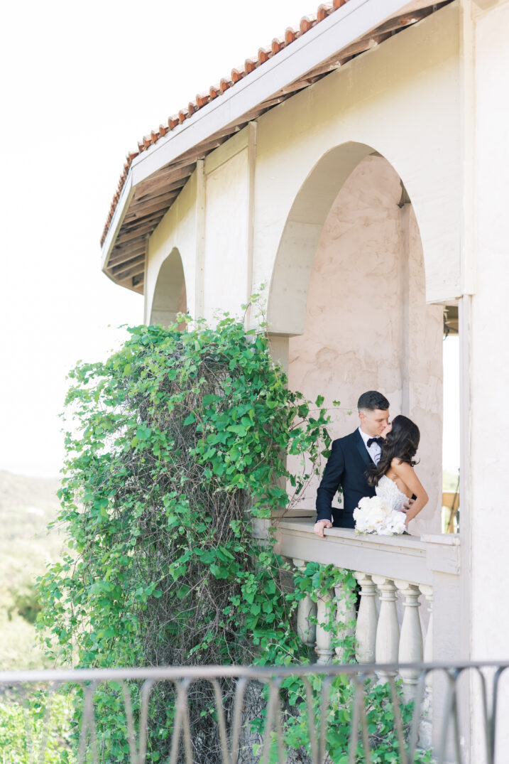 bride and groom embrace kiss Italian inspired wedding first look travel