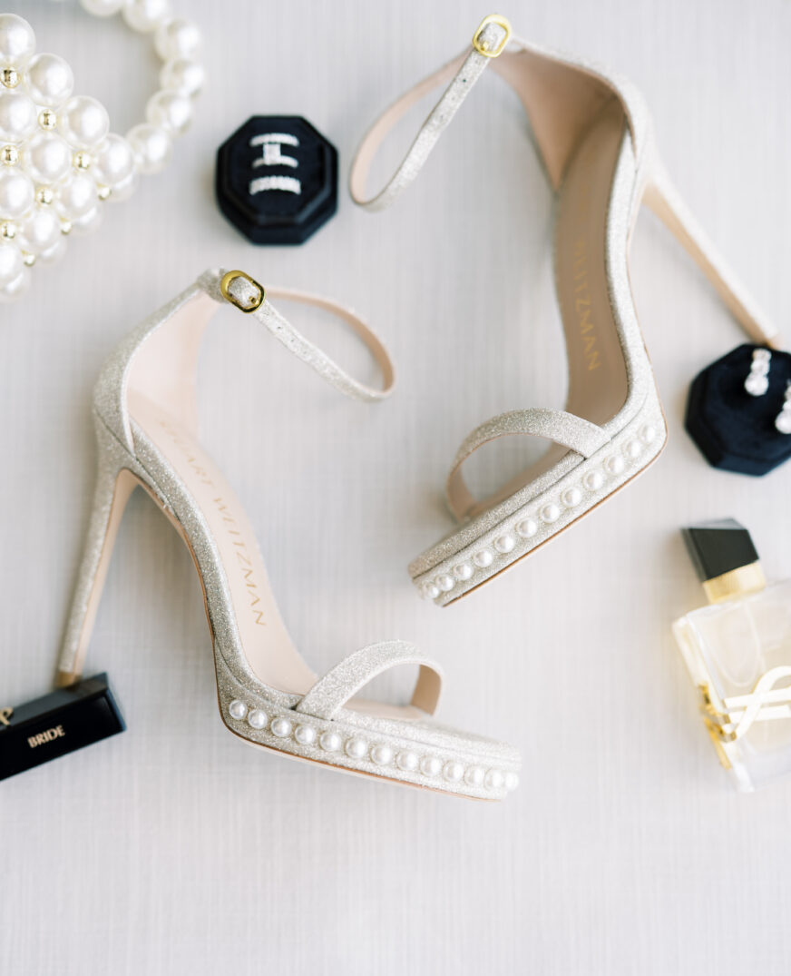 details of wedding with rings and bride's shoes 