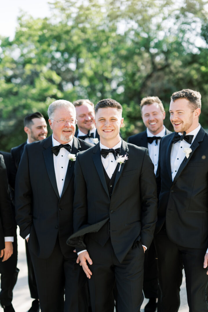 groom smiling with groomsmen black and white wedding bow tie Italian inspired 