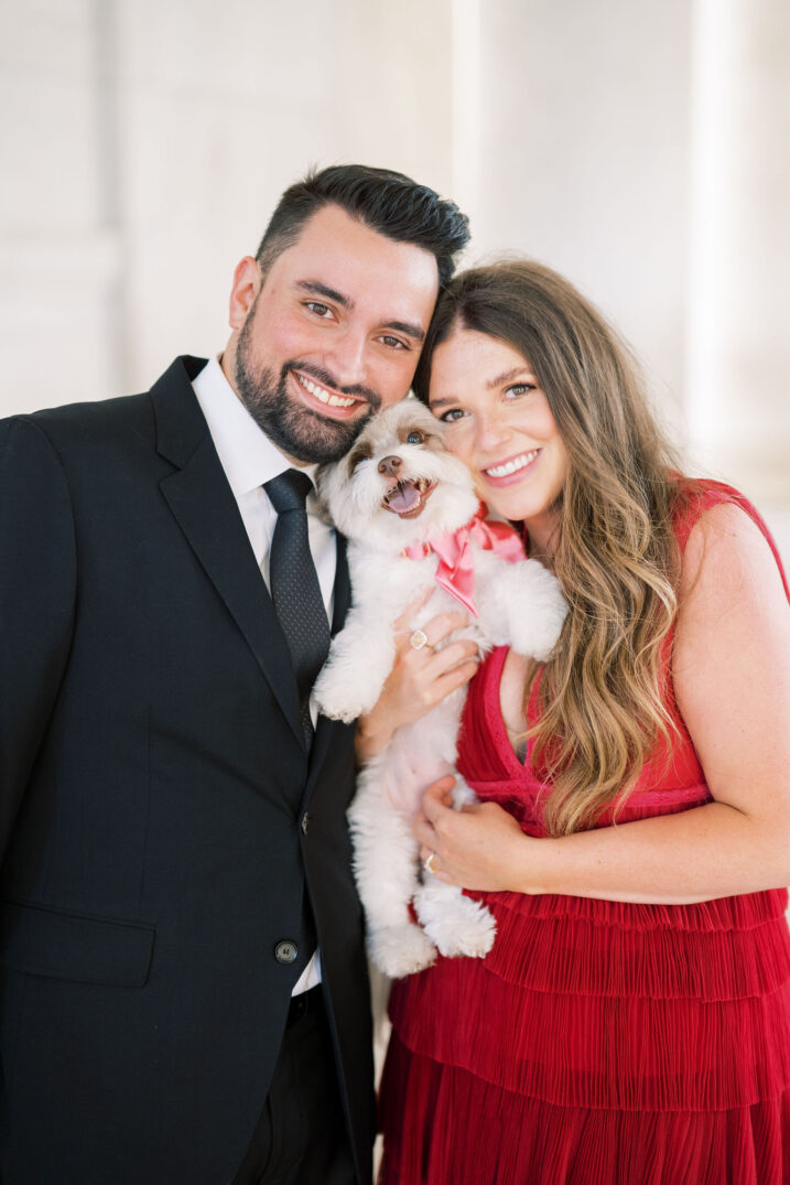 engaged couple with puppy