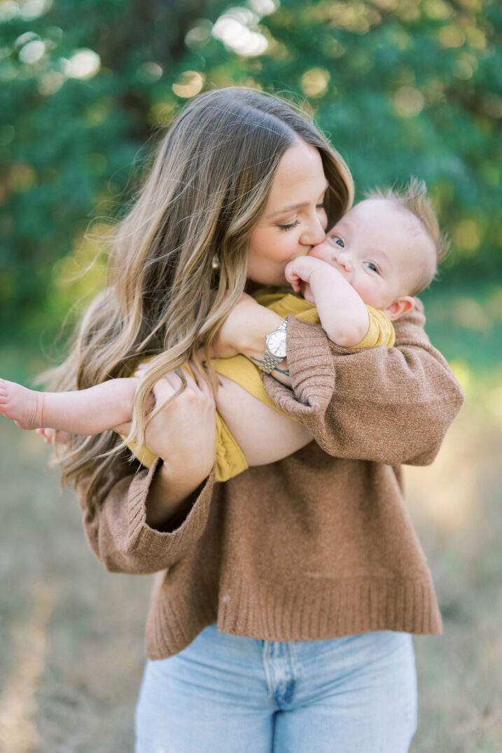 mom kissing baby