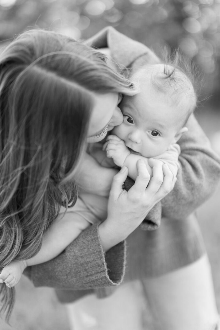 mom kissing baby