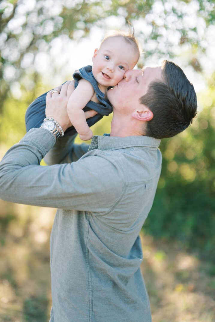 dad kissing baby