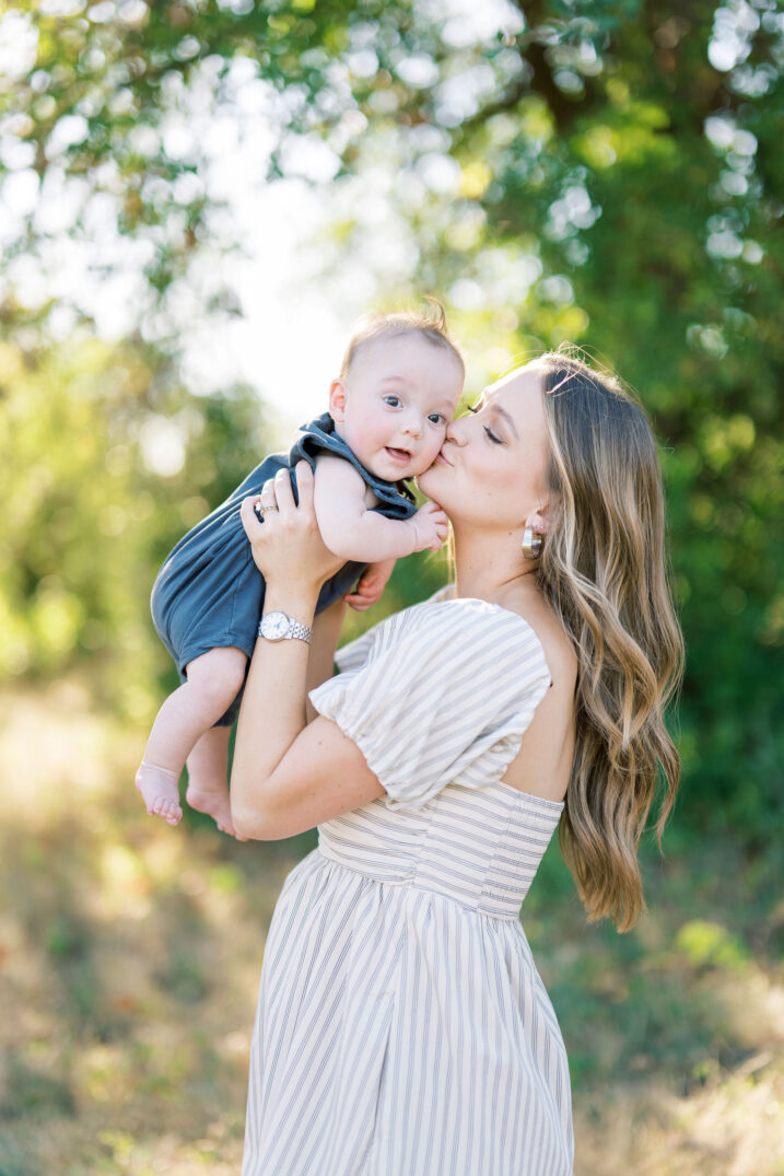 mom kissing baby